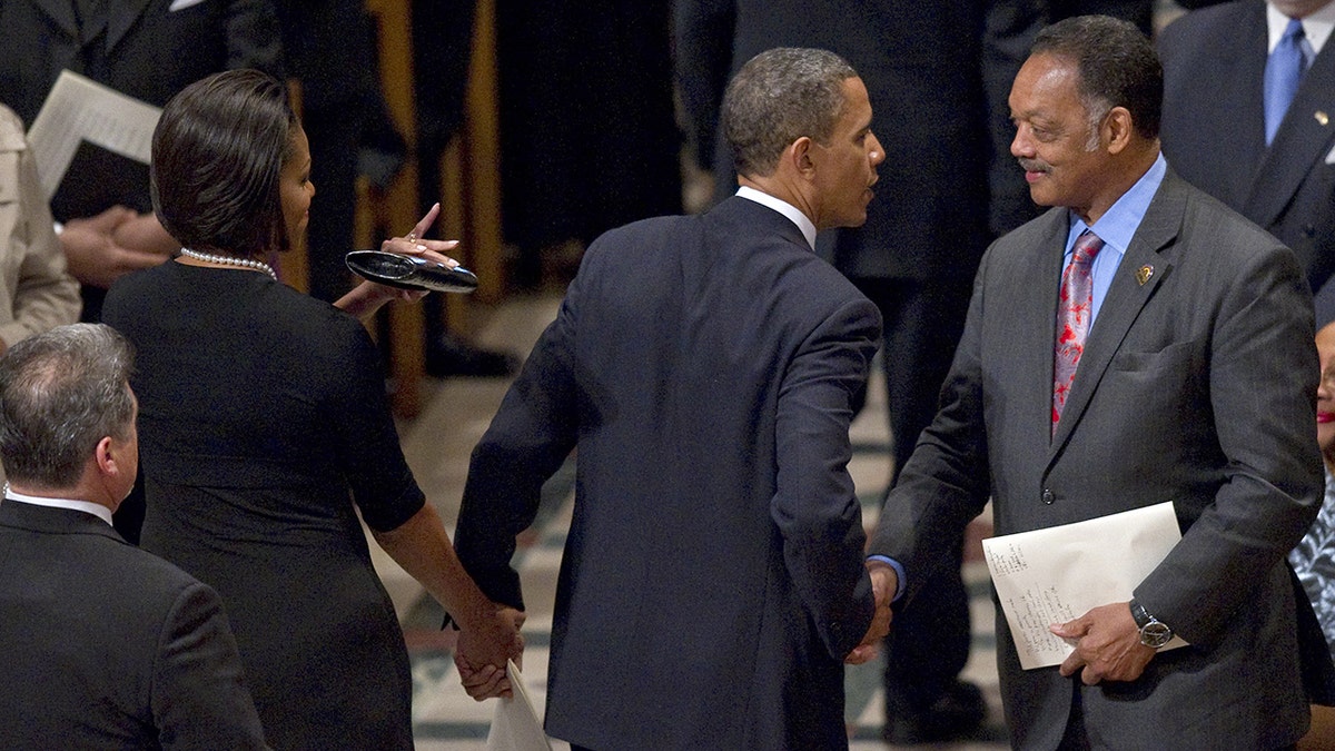 President Barack Obama shakes Rev. Jesse Jackson's hand in 2010