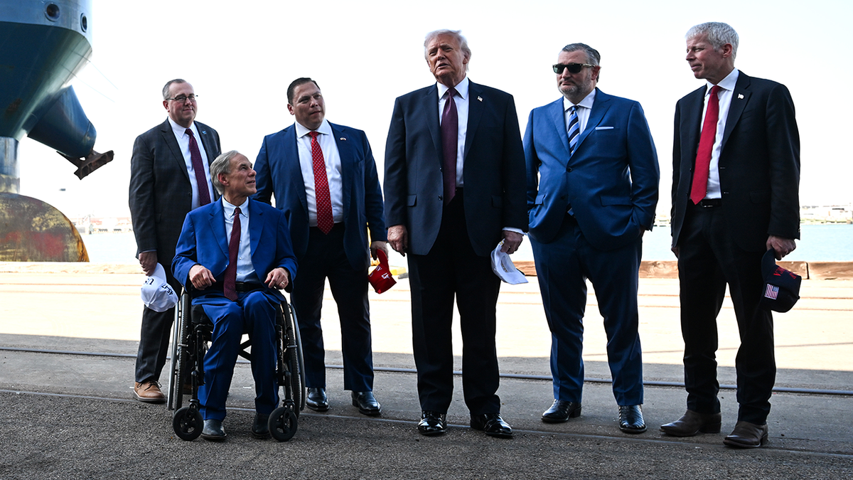 U.S. President Donald Trump (C) speaks to the media alongside (L-R) Port of Corpus Christi CEO Kent Britton, Texas Gov. Greg Abbott, Port Commission Chairman Gabe Guerra, U.S. Sen. Ted Cruz (R-TX) and U.S. Energy Secretary Chris Wright.
