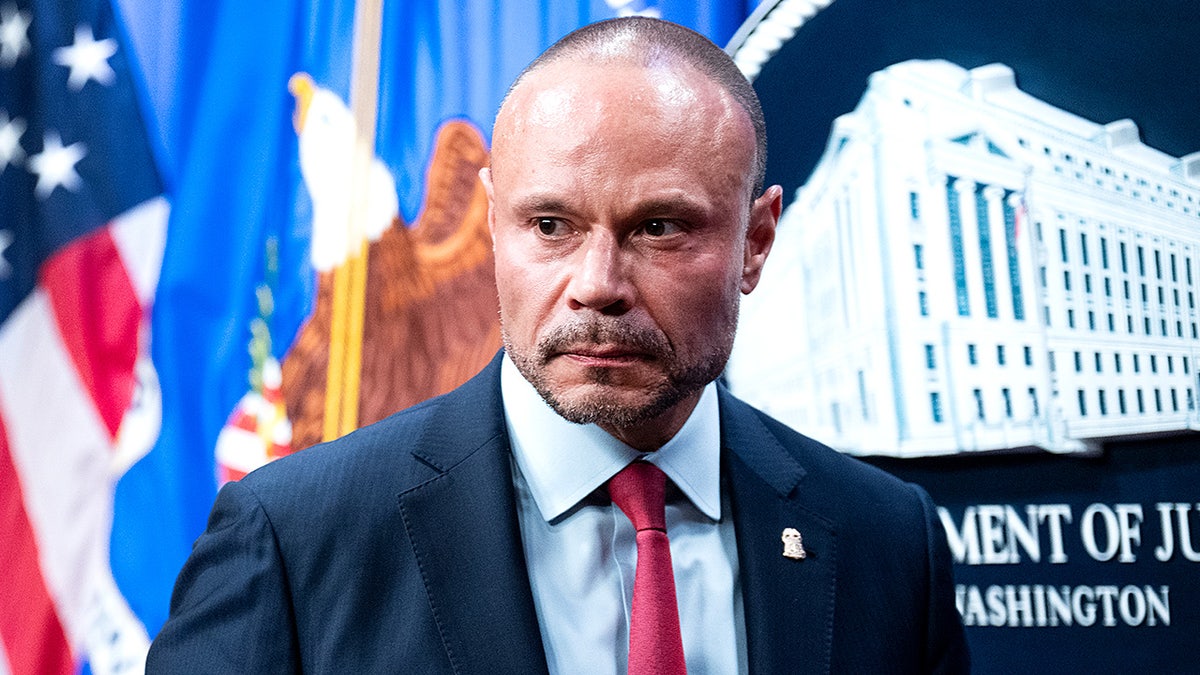 FBI Director Kash Patel stands beside Deputy FBI Director Dan Bongino during a news conference.
