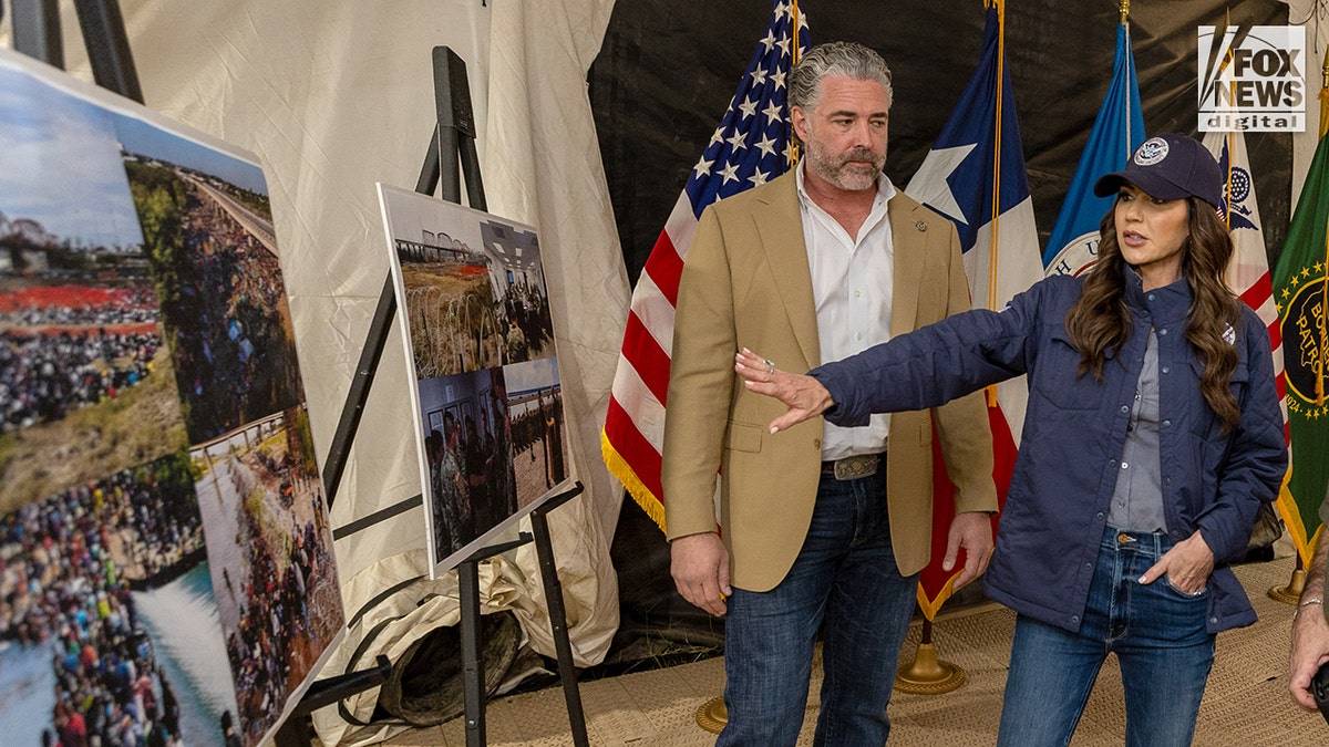 Kristi Noem standing with CBP officials outdoors in Eagle Pass, Texas