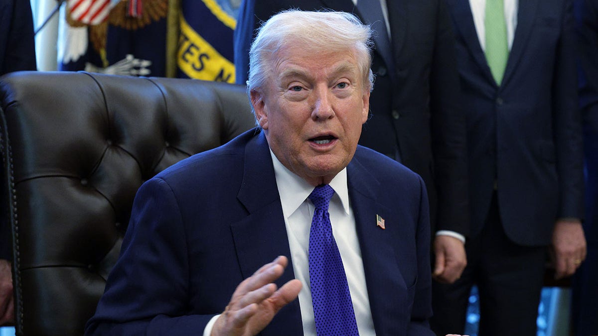 President Donald Trump sits in the Oval Office. 
