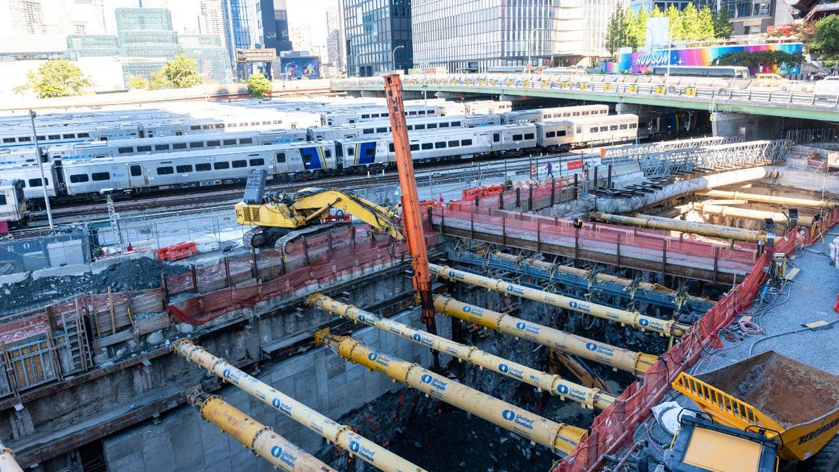 Construction equipment and rail lines at the Gateway Tunnel project site in New York City.