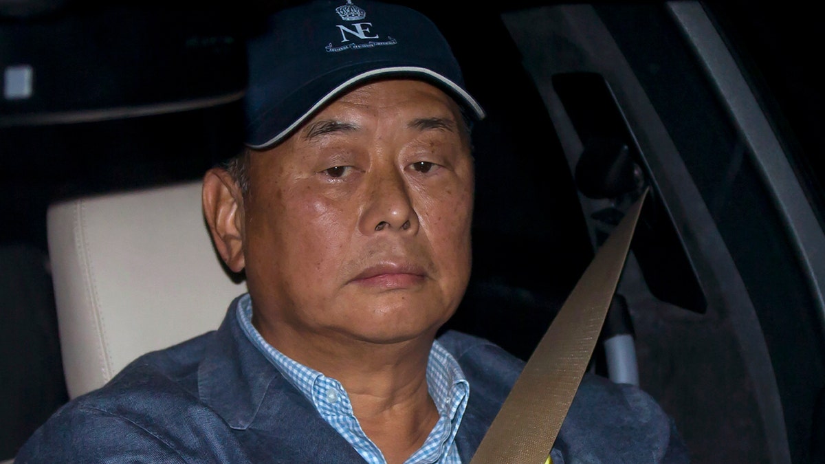 Jimmy Lai in a vehicle.