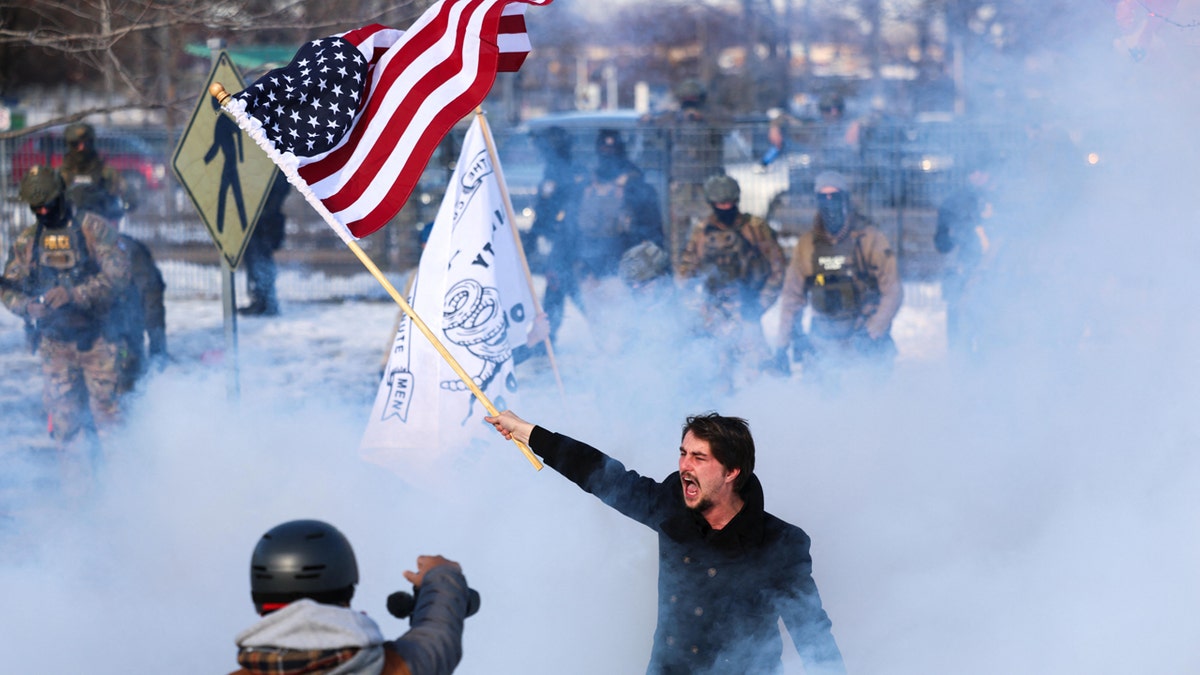 Man waves flag during protest