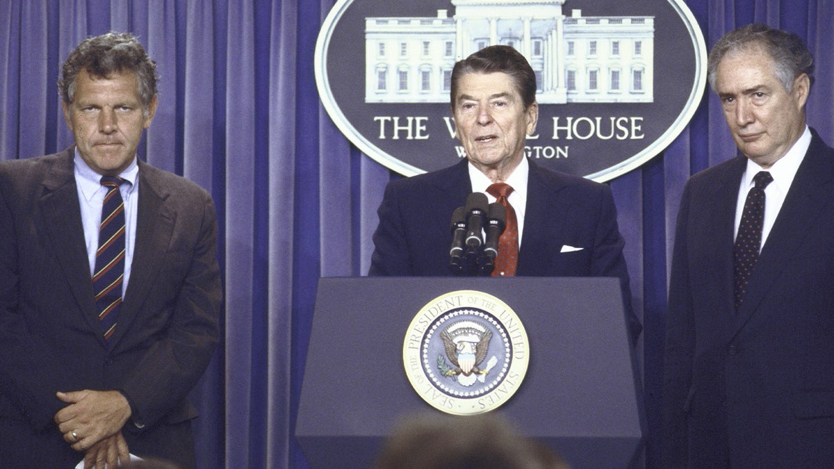 Reagan speaking next to Education Secretary Bill Bennett