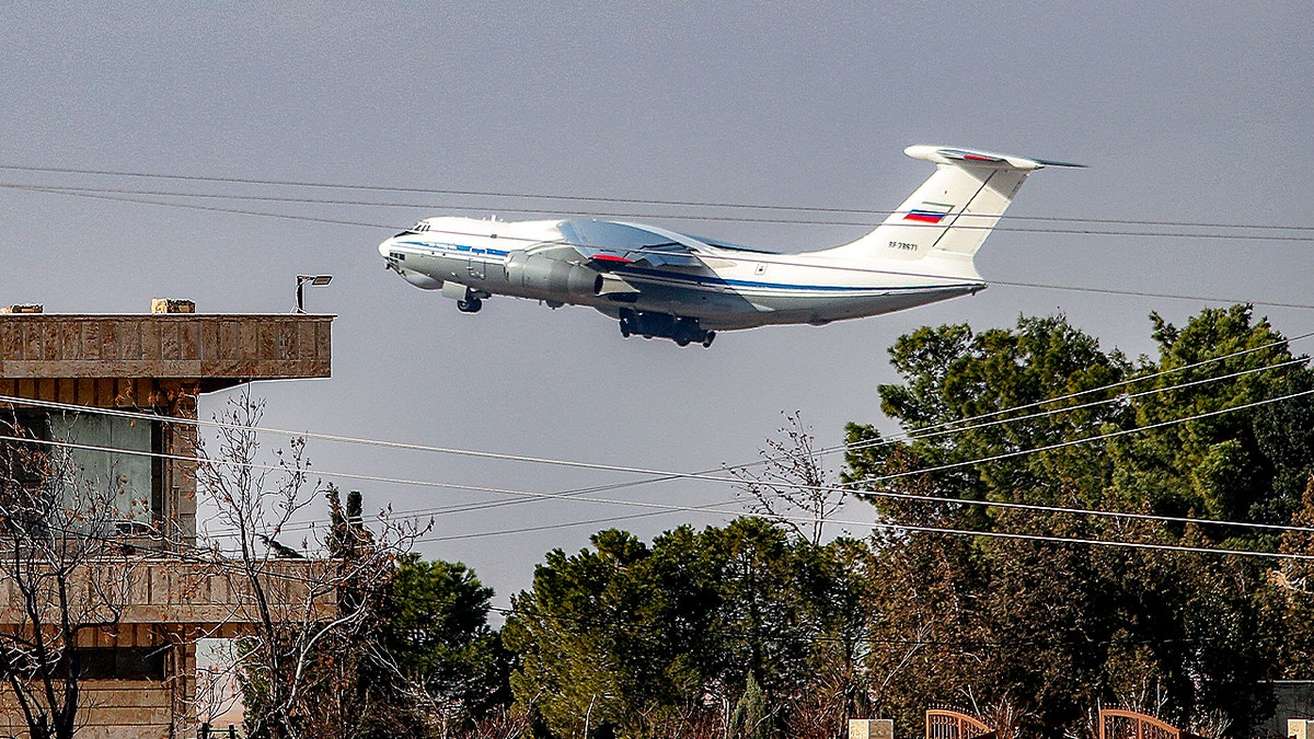 A Russian military Ilyushin Il-76 strategic airlift aircraft takes off from Qamishli International Airport in northeastern Syria's Hasakah province on January 27, 2026. Russia withdrew troops and equipment on January 27 from the airport in Kurdish-held northeast Syria where its forces were based, as Kurdish forces who once controlled swathes of territory in the country's north and east have withdrawn in the face of military pressure of Syrian army advance while the country's new Islamist authorities seek to extend control across the country. 