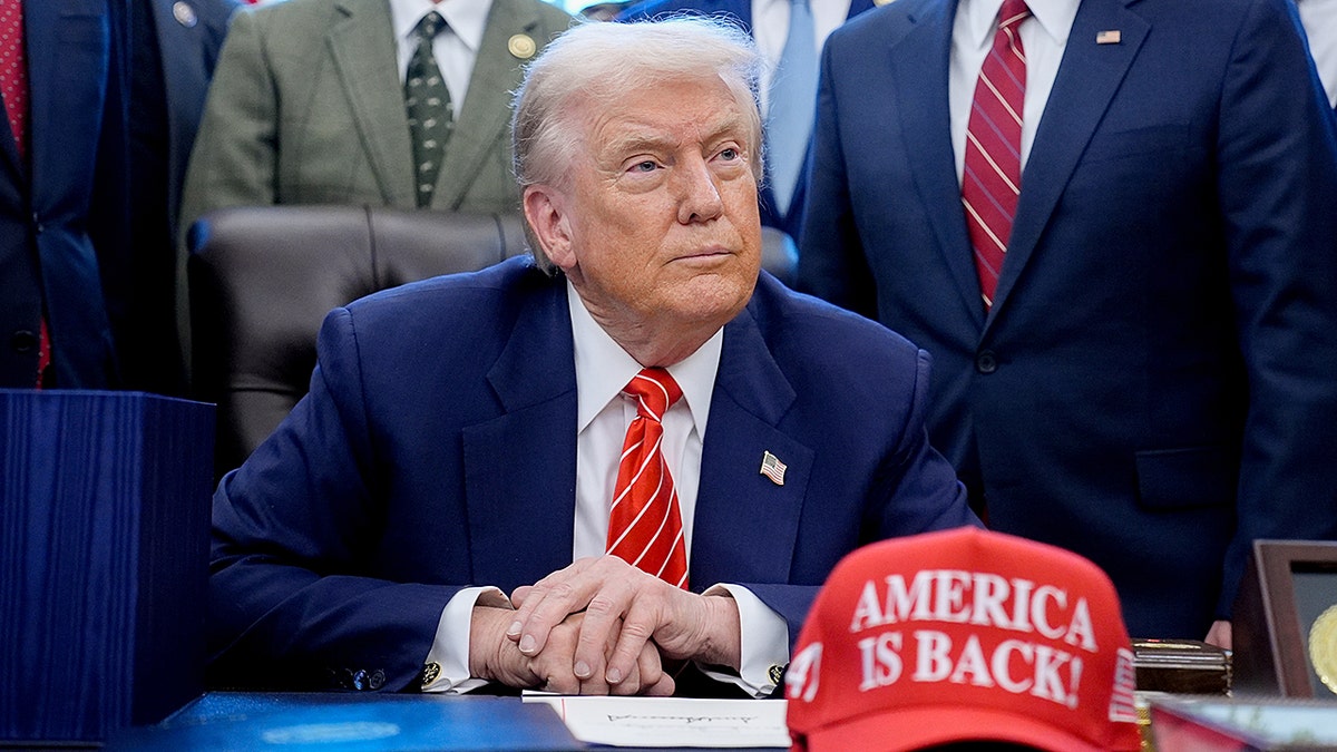 President Trump and "America is Back!" hat