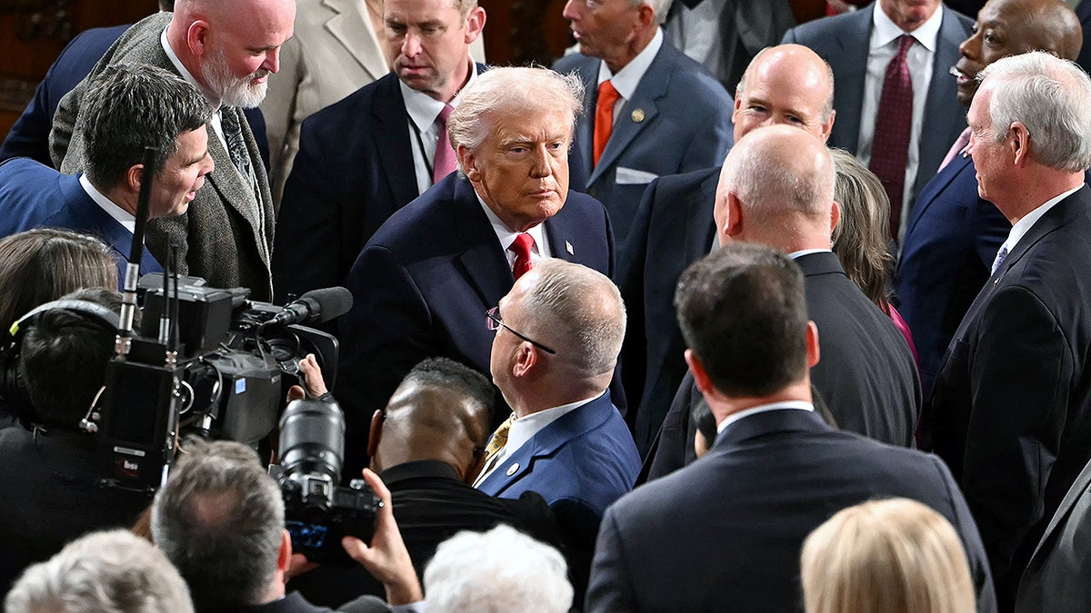 Trump greets lawmakers in the House chamber