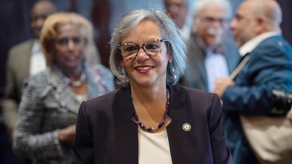 Robin Kelly walks ahead of a policy speech to a civic audience in Chicago.