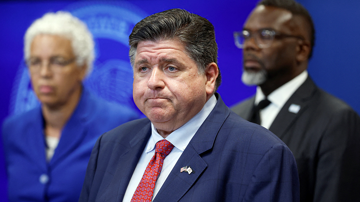 JB Pritzker frowns while speaking in Cook County
