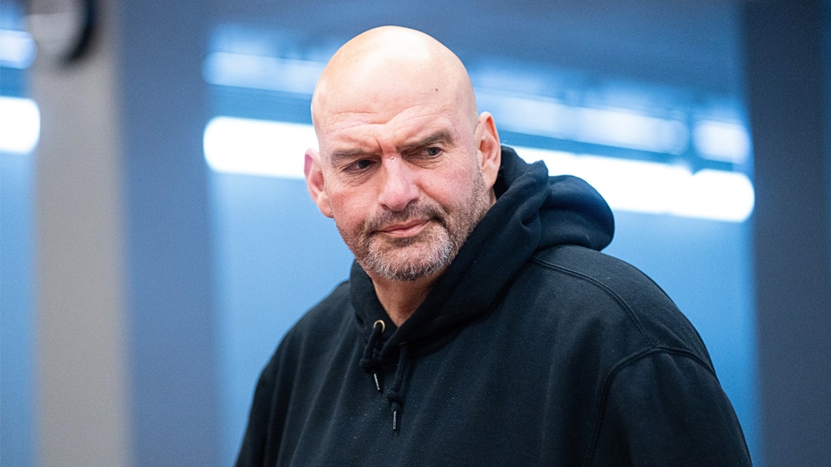Sen. John Fetterman speaking to a reporter outside the U.S. Capitol