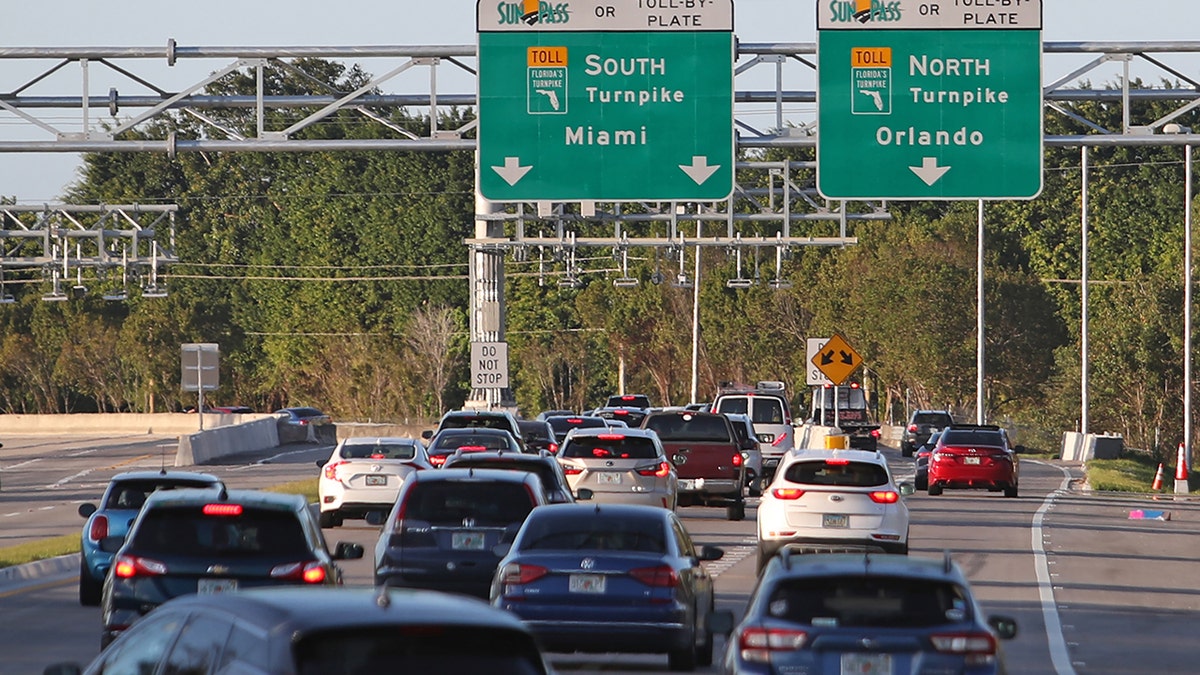 Cars are backed up on a Florida turnpike.
