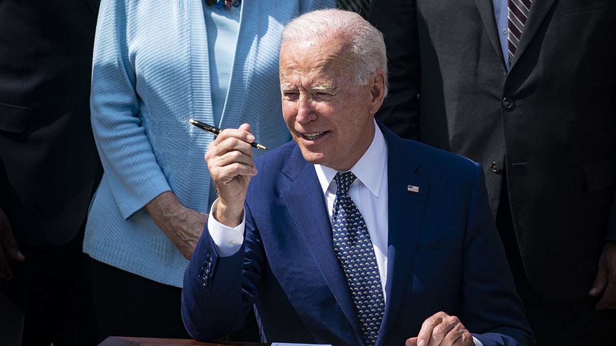 Joe Biden holding pen