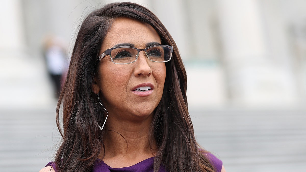 Rep. Lauren Boebert walks outside the U.S. Capitol.