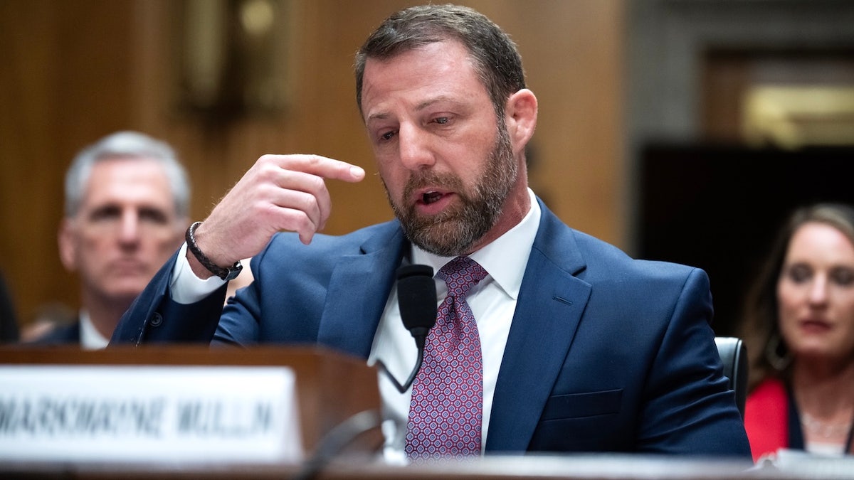 Sen. Markwayne Mullin, R-Okla., speaks as he fights through tears