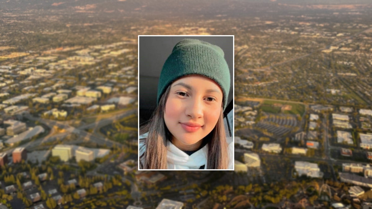 Kembery Chirinos-Flores in front of the Santa Clara, CA skyline.