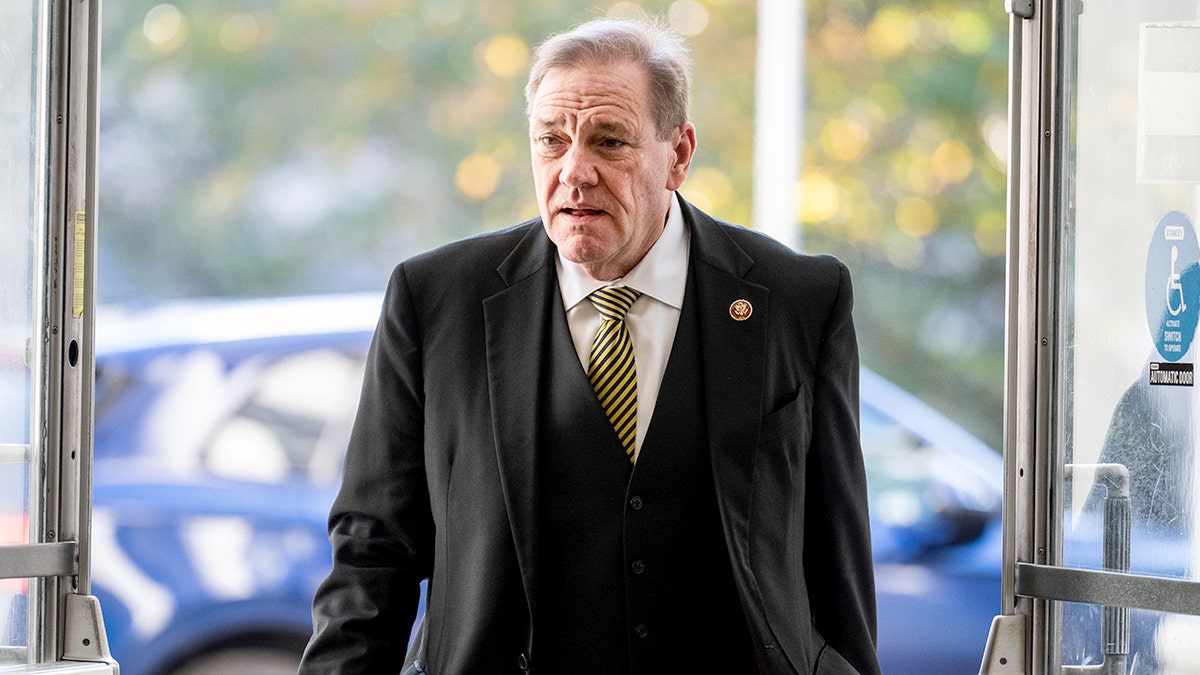 Florida congressman walks toward a House office building on Capitol Hill.