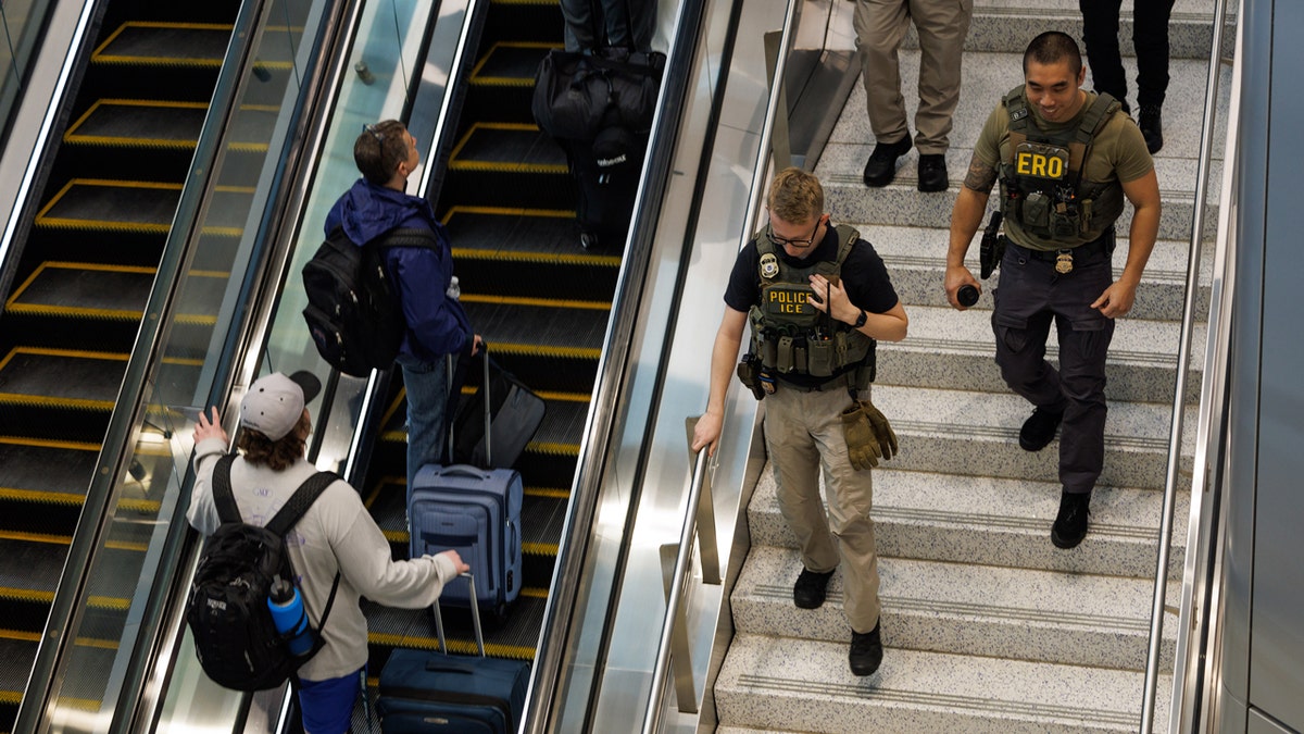ice agents on elevator at newark airport