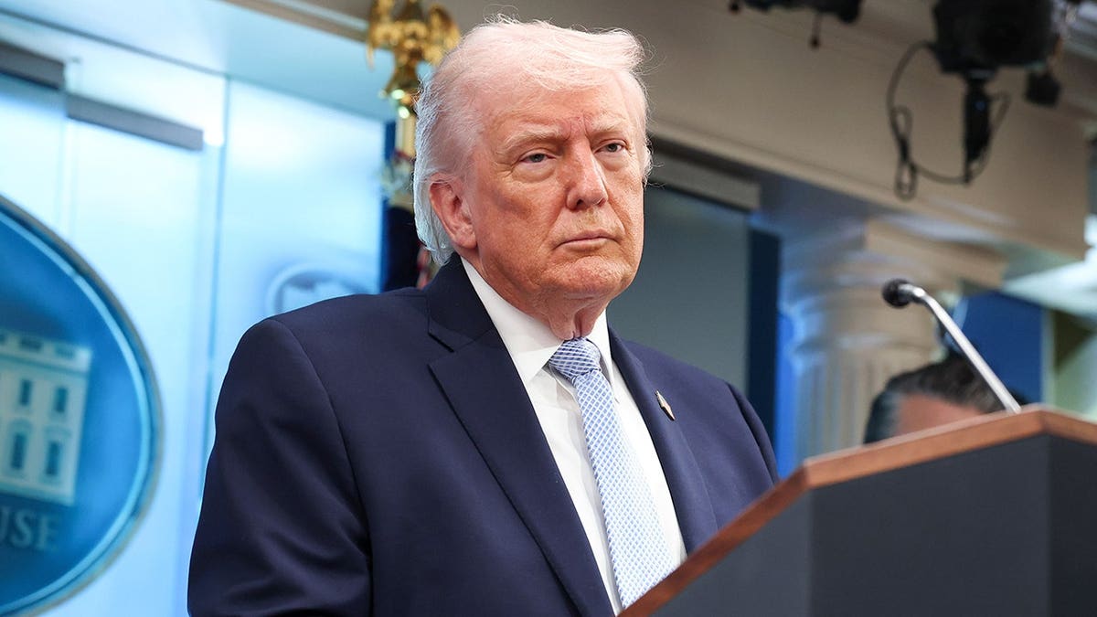 President Donald Trump at podium during news White House news conference