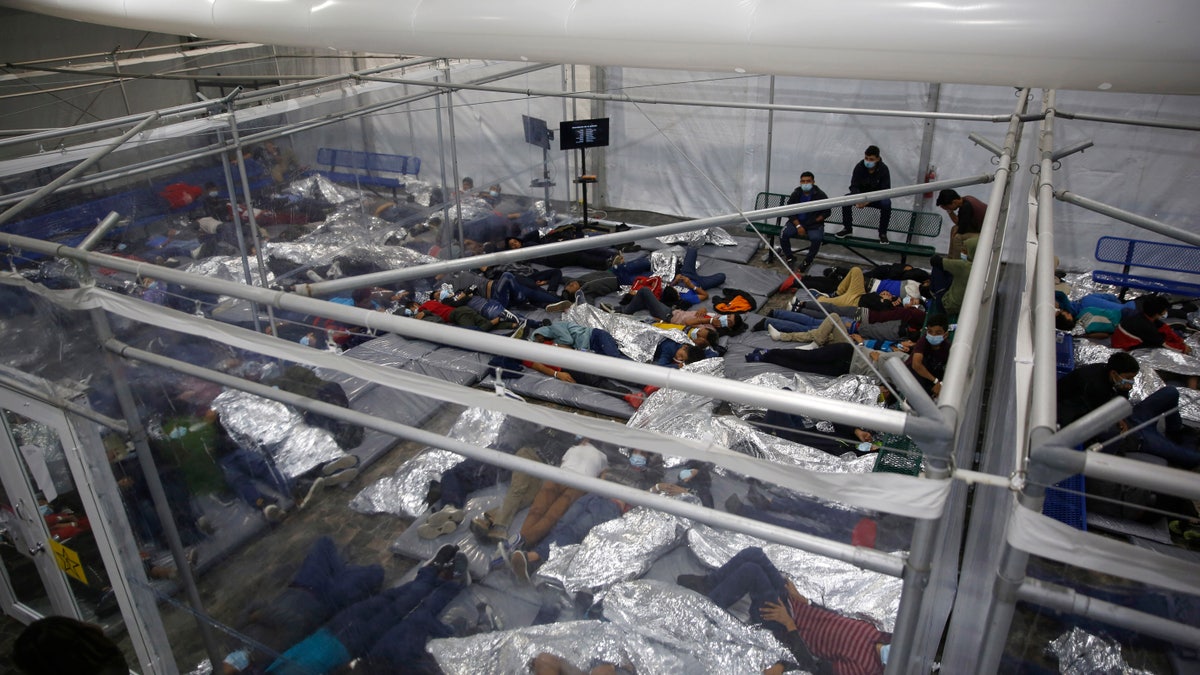 Minor children resting inside a pod at the Donna Department of Homeland Security holding facility