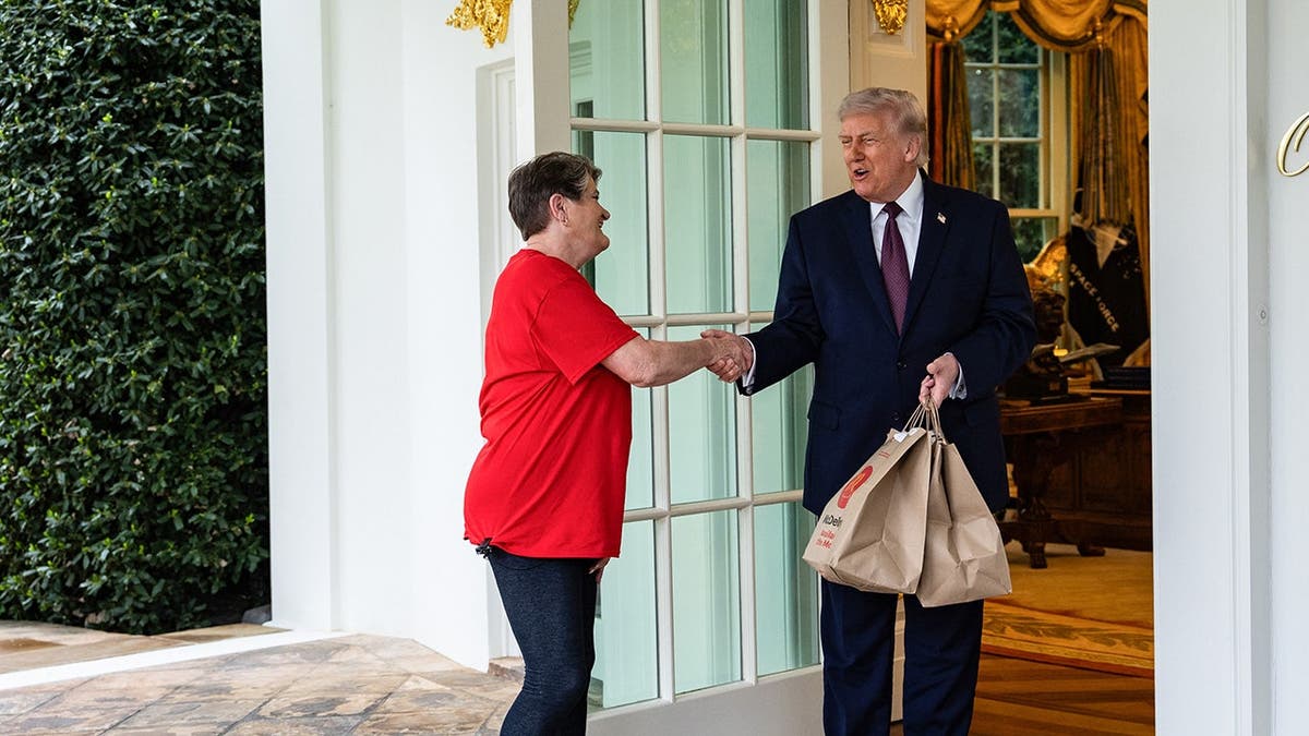 Sharron Simmons shakes hands with President Donald Trump