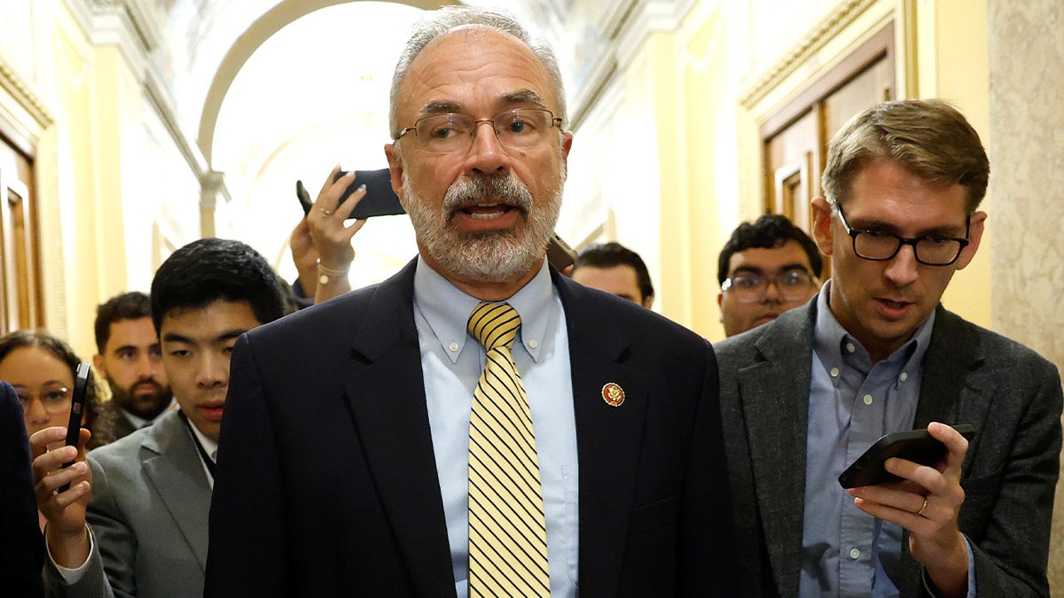 Rep. Andy Harris walking to the House Chamber at the U.S. Capitol surrounded by reporters