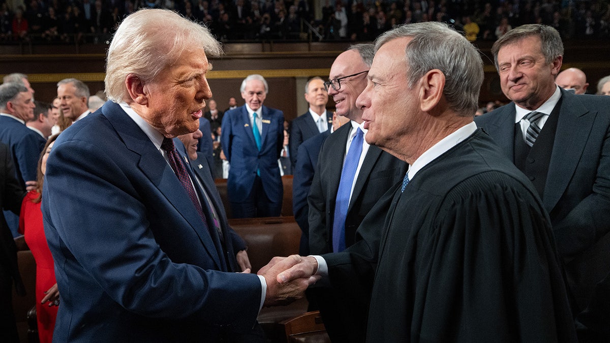 President Donald Trump greets Chief Justice John G. Roberts Jr. at U.S. Capitol