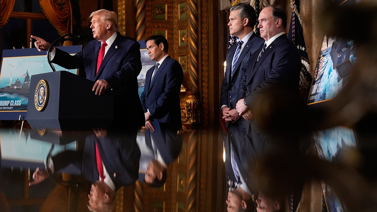 President Donald Trump speaking at Mar-a-Lago with Secretary of State Marco Rubio, Defense Secretary Pete Hegseth, and Secretary of the Navy John Phelan