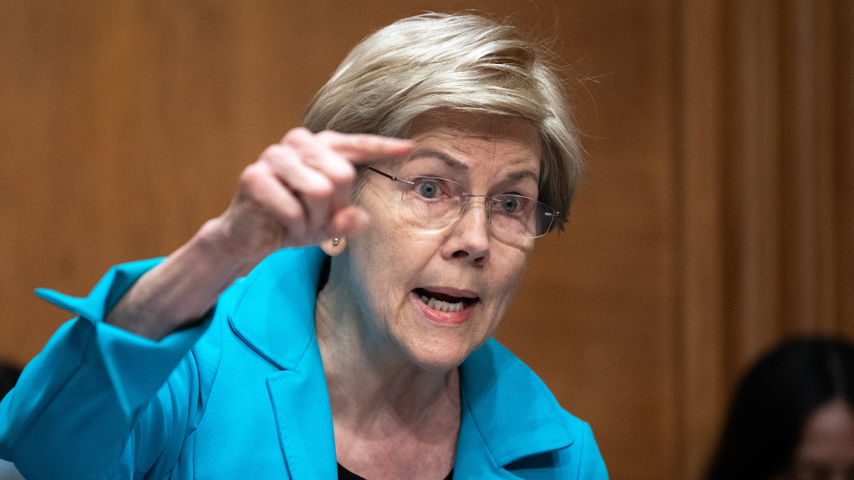 Senator Elizabeth Warren is seen asking questions of Kevin Warsh during his confirmation hearing.