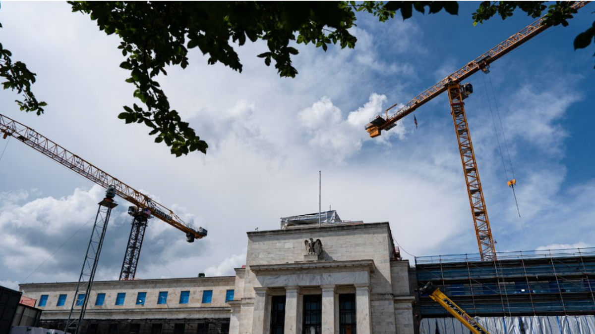 Construction on the Marriner S. Eccles Federal Reserve building with cranes in Washington, D.C.