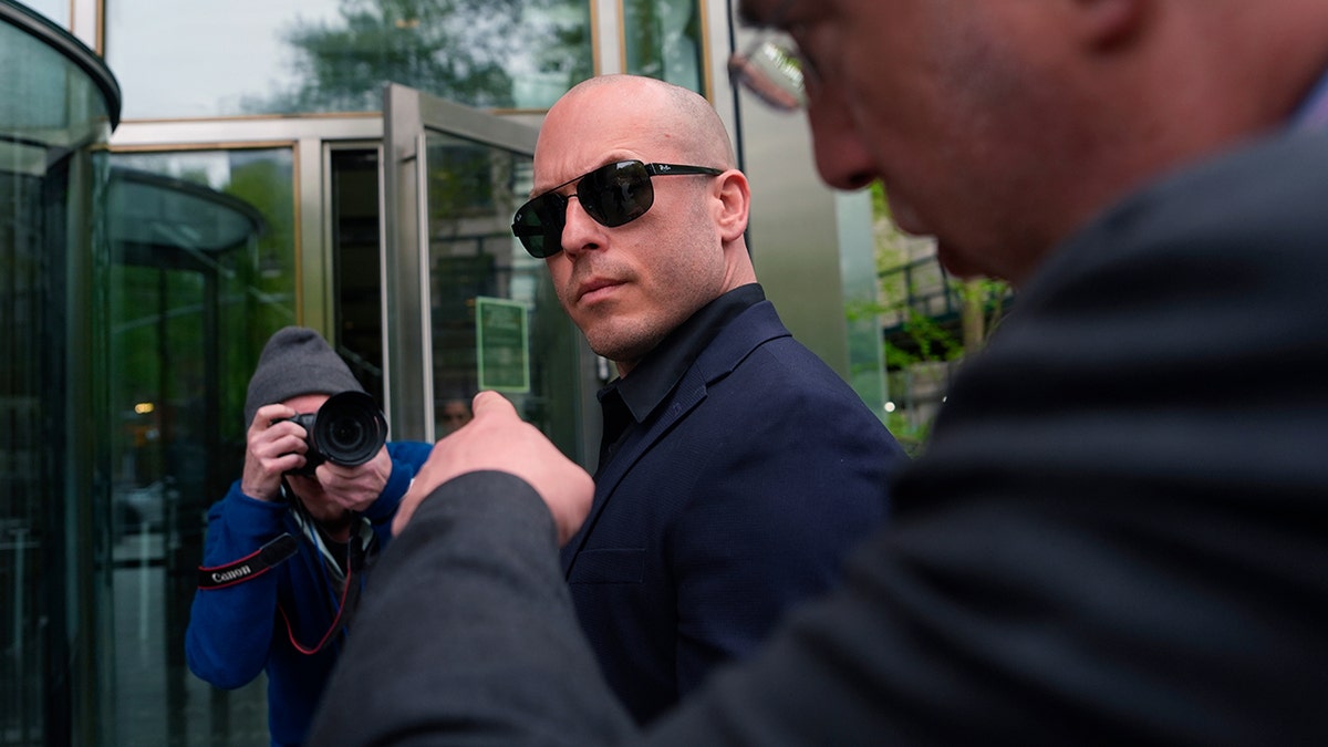 Gannon Ken Van Dyke walking outside a federal courthouse in New York
