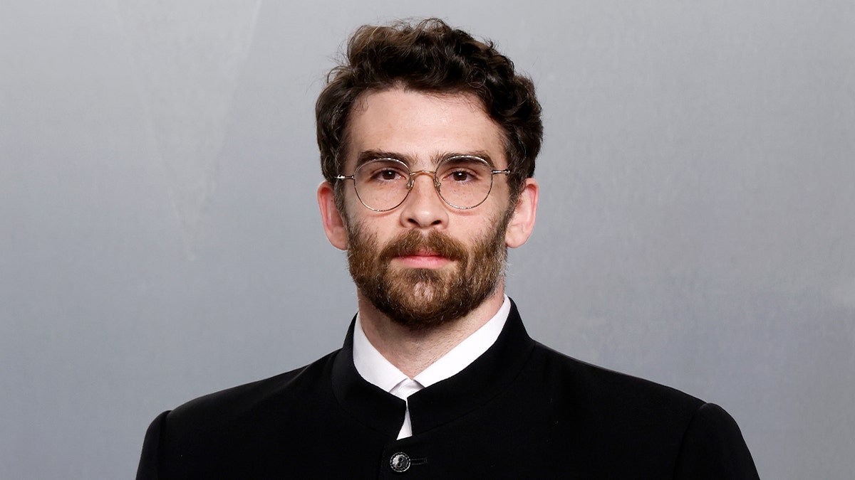 Hasan Piker standing at the Vanity Fair Oscar Party at Los Angeles County Museum of Art