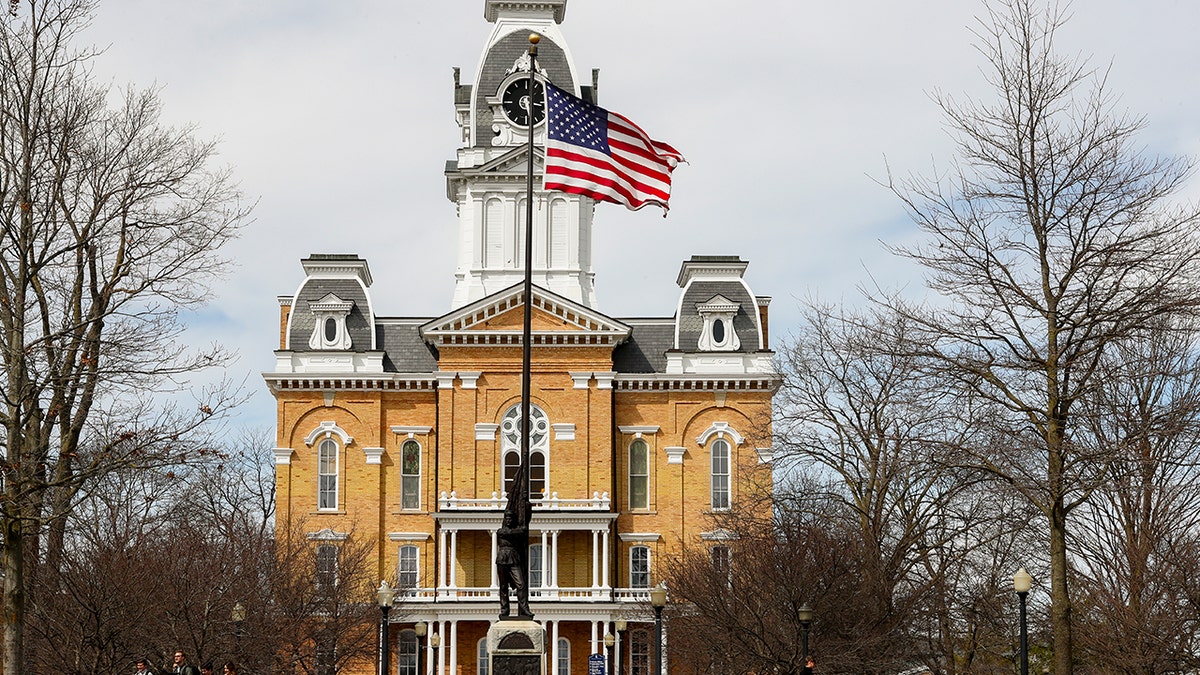 Florida Governor Ron DeSantis speaking outside a building at Hillsdale College in Hillsdale, Michigan