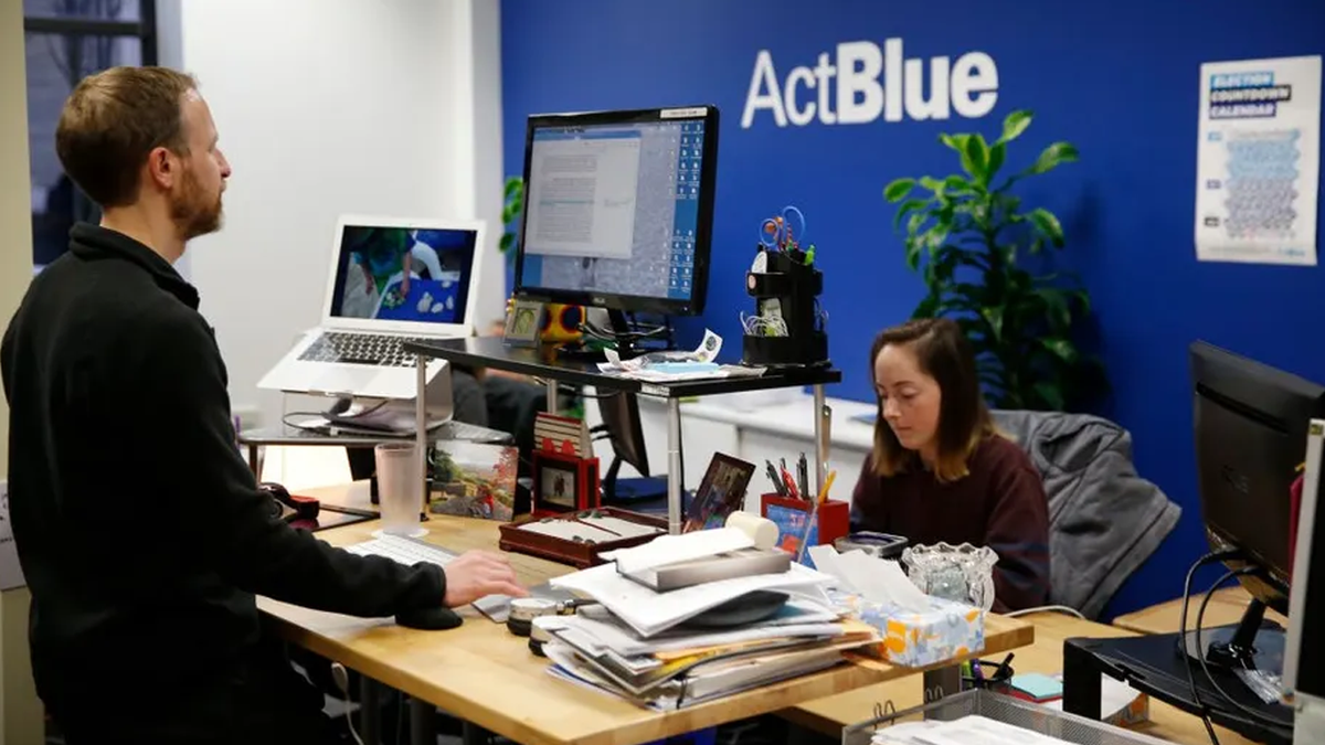 a person at an ActBlue office sits at a desk