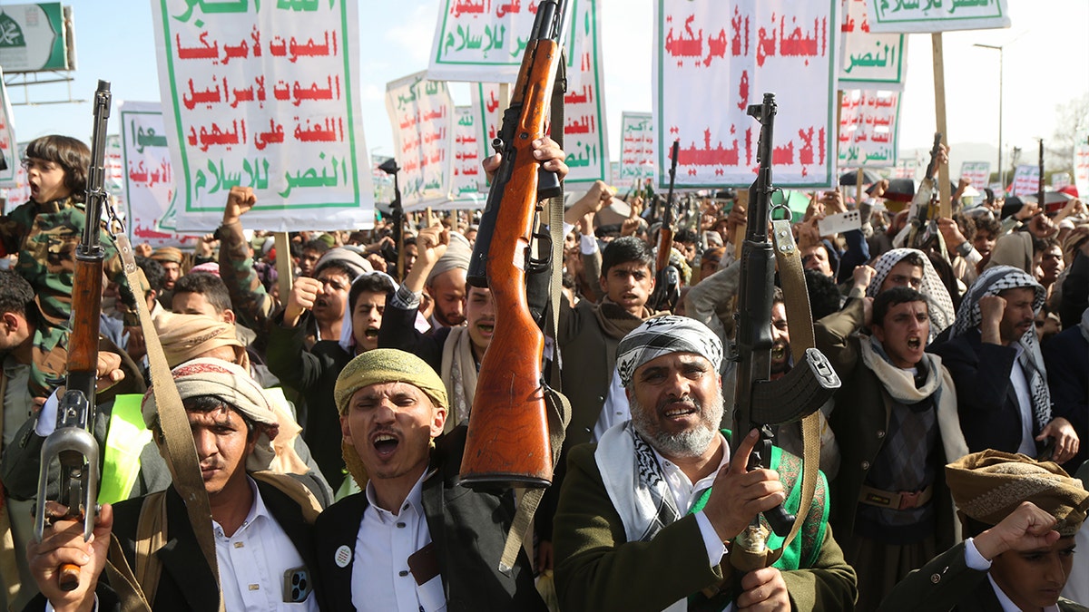 Yemen's Houthi supporters brandish weapons and shout anti-U.S. and Israel slogans during a demonstration staged to show solidarity with Iran on April 3, 2026 in Sana'a, Yemen. 