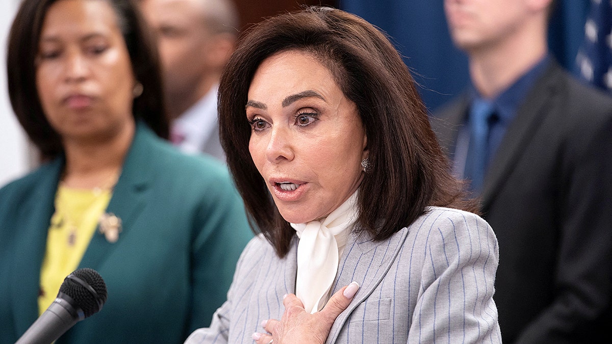 U.S. Attorney Jeanine Pirro speaking at a Justice Department press conference with D.C. Mayor Muriel Bowser
