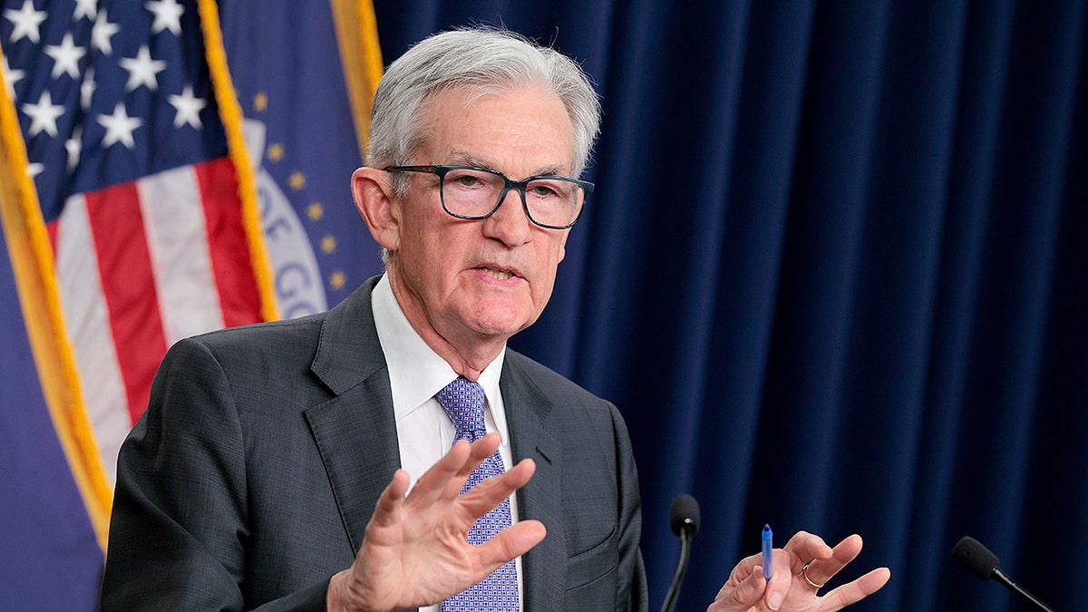 Federal Reserve Chair Jerome Powell speaking at a press conference in Washington, D.C.