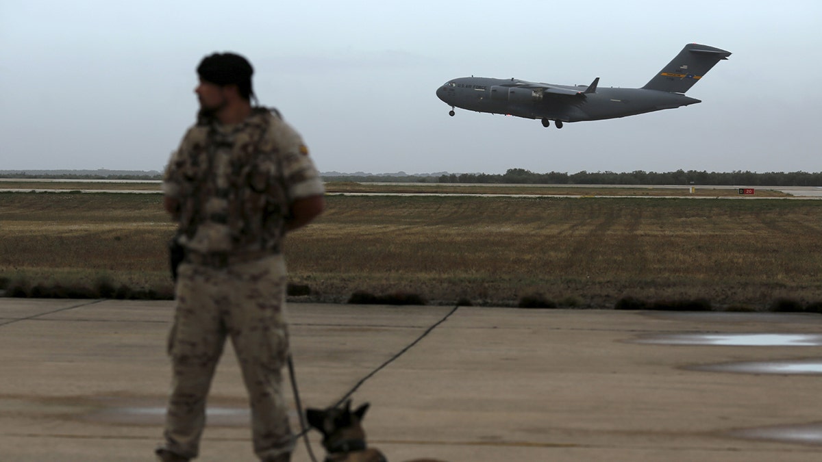 U.S. Air Force plane flying before landing at Moron military airbase in southern Spain