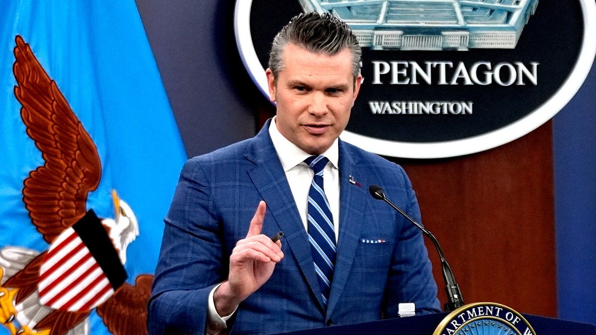 War Secretary Pete Hegseth speaking during a press briefing at the Pentagon
