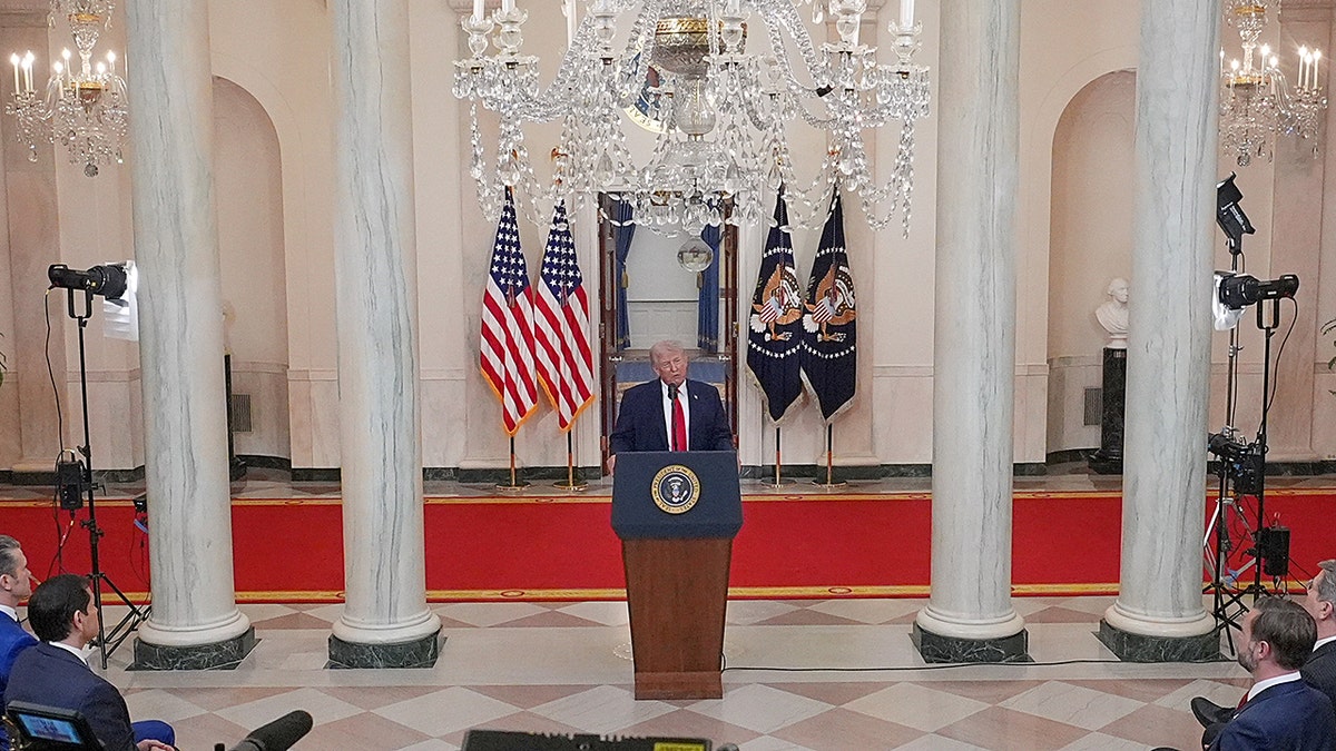 President Donald Trump speaking in the Cross Hall of the White House