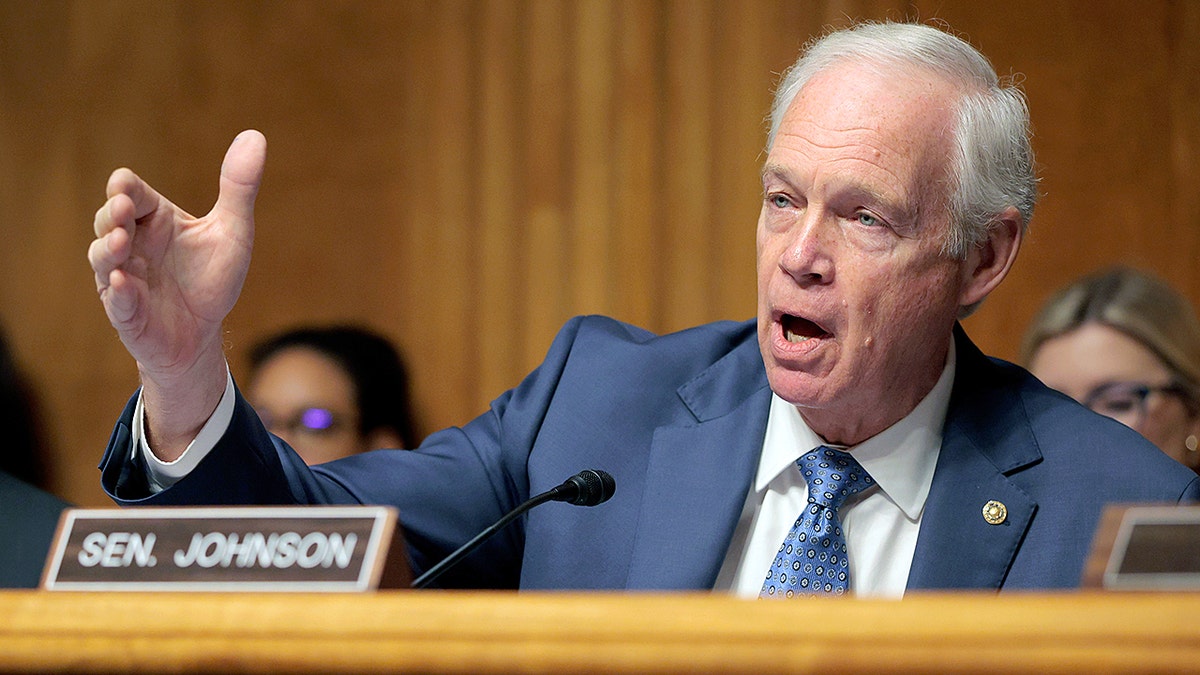 Sen. Ron Johnson speaking at a podium during a Senate committee hearing in Washington, D.C.