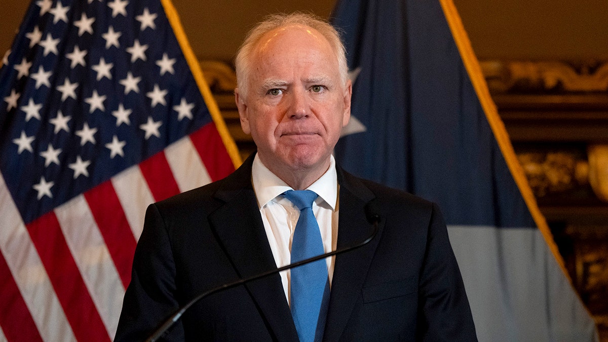 Minnesota Gov. Tim Walz speaking at a press conference at the State Capitol in St. Paul
