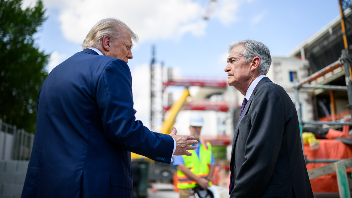 President Donald Trump speaking to Fed Chair Jerome Powell at Federal Reserve construction site