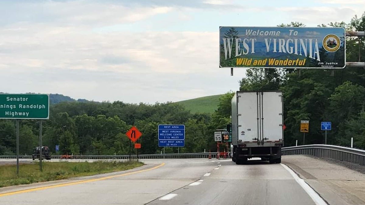 A sign welcoming travelers to West Virginia from Pennsylvania on Interstate 79 in Monongalia County