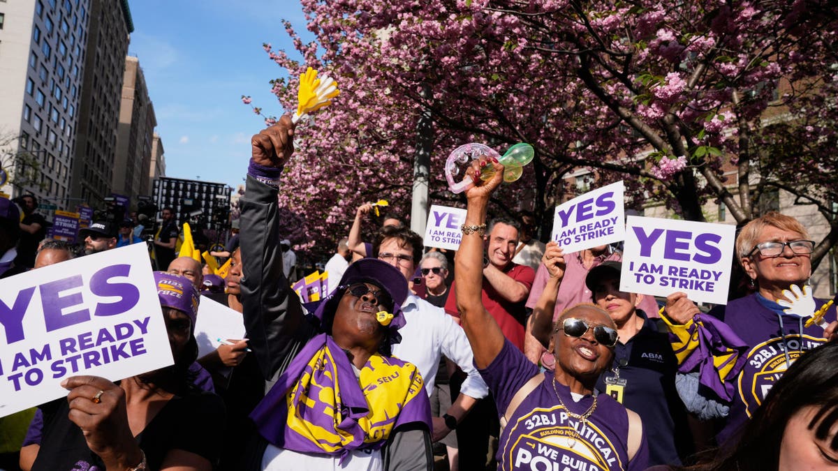 Members of the 32BJ SEIU union rally on Park Avenue in New York City
