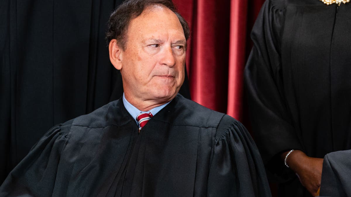 Associate Justice Samuel Alito Jr. standing during a group photograph at the Supreme Court in Washington, D.C.