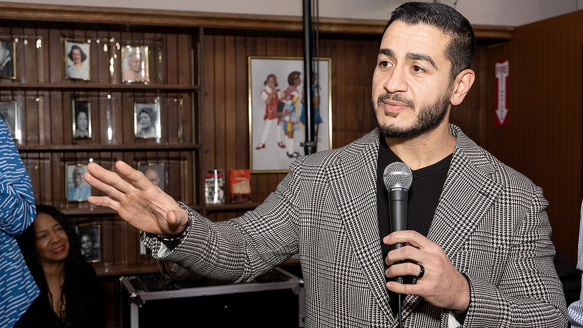 Abdul El-Sayed standing and speaking at an event