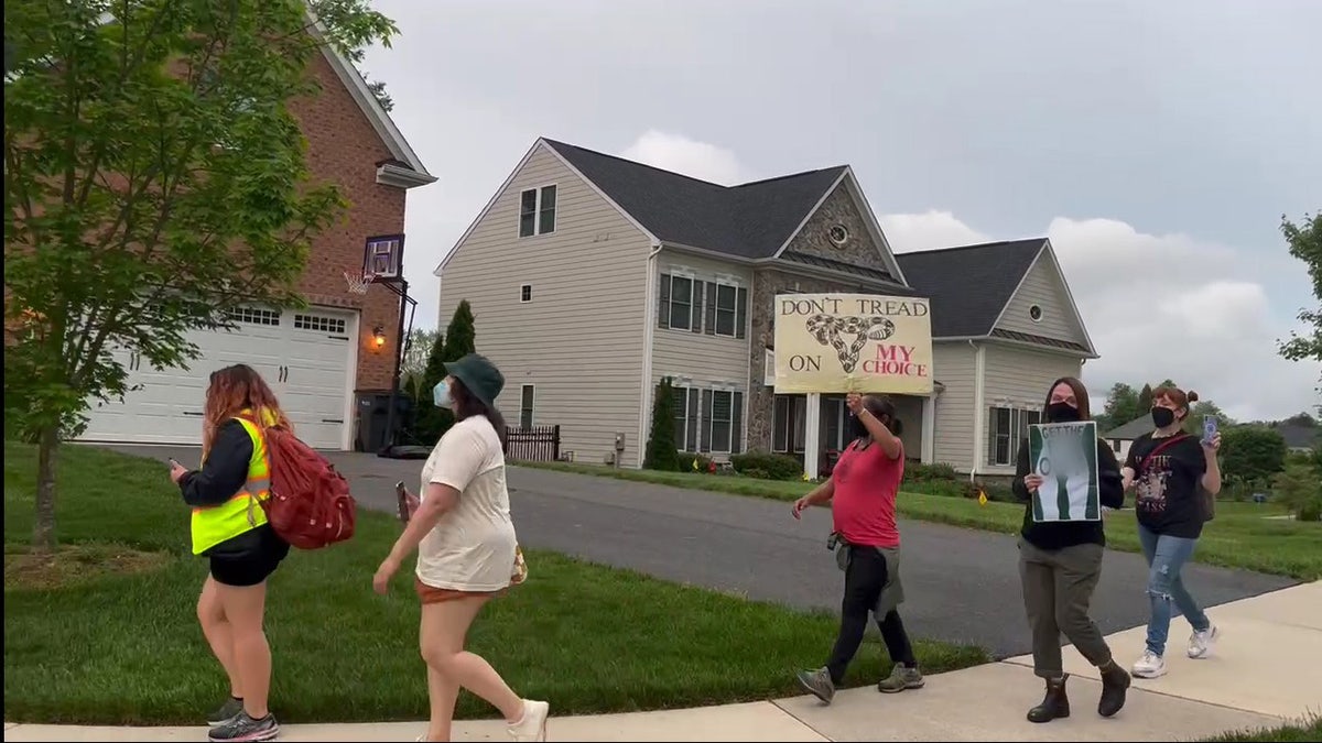 Protesters gathered near the home of Justice Barrett
