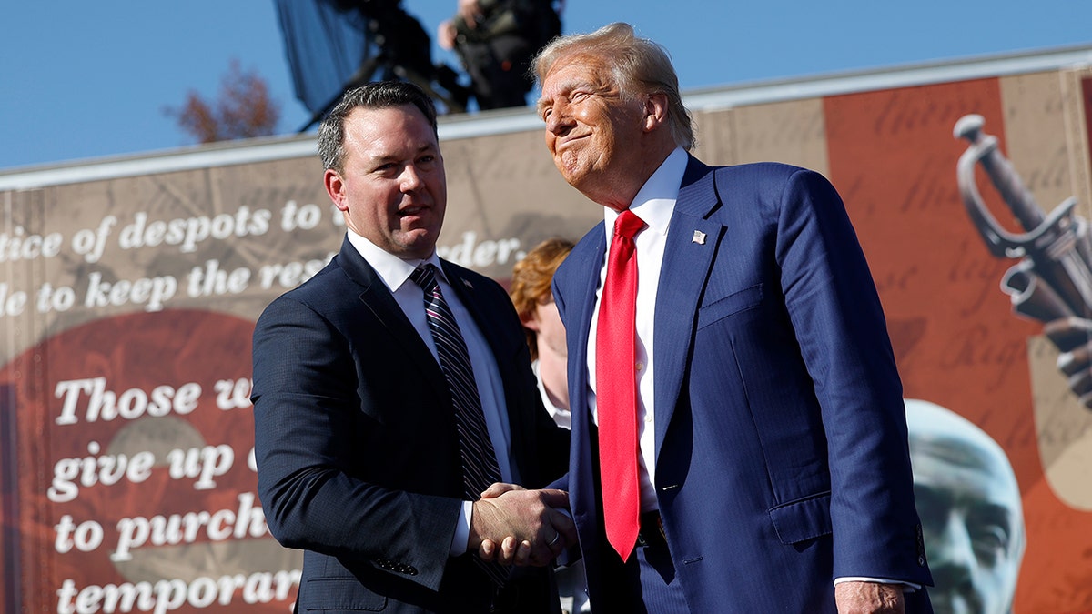 Donald Trump shaking hands with Georgia Lt. Gov. Burt Jones at Christ Chapel in Zebulon