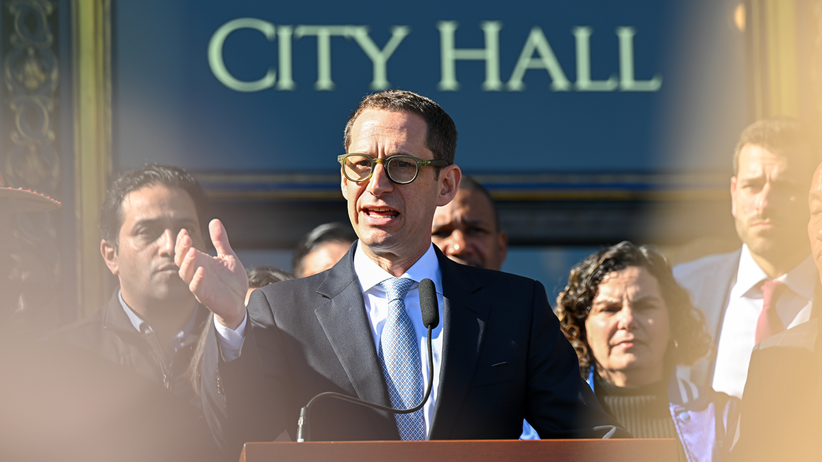 Mayor Daniel Lurie speaking on steps of City Hall in San Francisco